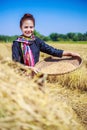 Farmer woman threshed rice in field Royalty Free Stock Photo