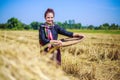 Farmer woman threshed rice in field Royalty Free Stock Photo