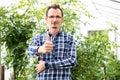 Farmer at work in greenhouse. Royalty Free Stock Photo