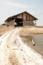 Farmer working at Salt pile in ThailandHUAHIN, THAILAND - MAY 13, 2008: Unidentified people carry salt at the salt farm in Huahin,