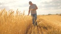 Farmer working with tablet computer on wheat field. agricultural business. businessman analyzing grain harvest Royalty Free Stock Photo