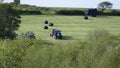 Farmers bailing hay Royalty Free Stock Photo