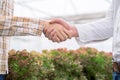 Farmers and businessmen agreed to do business together while holding hands.