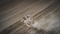 Farmers cultivating. Tractor makes vertical tillage. Aerial view