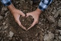 Farmers' expert hands check soil health before planting vegetable seeds or seedlings. Business idea or ecology