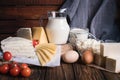 Farmers food products: milk, cream, cheese, eggs, cottage, butter. Rustic composition. Organic food concept
