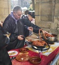 Farmers frying Txistorra in Santo Tomas Fair. San Sebastian, Spain