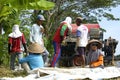 Farmers are grinding rice with a mobile rice milling machine. Royalty Free Stock Photo