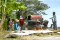 Farmers are grinding rice with a mobile rice milling machine. Royalty Free Stock Photo