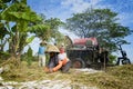 Farmers are grinding rice with a mobile rice milling machine. Royalty Free Stock Photo