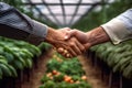 Farmers Handshake Against Backdrop Of Unfocused Horticulture Farm, Closeup. Generative AI Royalty Free Stock Photo