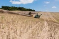 Farmers are harvesting with a New Holland CR9080 combine