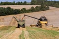 Farmers harvesting and unloading the threshed seeds