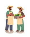 farmers holding basket full of fresh vegetables happy labor day celebration concept vertical