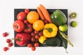 Farmers market concept with vegetables and fruits in dark wooden box isolated on white background Royalty Free Stock Photo