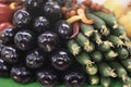 Farmers market counter with fresh organic eggplant, cucumber and chilli pepper, vegetables closeup, heap of live