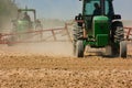 Farmers plowing the field