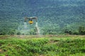 farmers are using Flying drone spraying medicine in agriculture