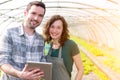 Farmers watching stats on tablet Royalty Free Stock Photo