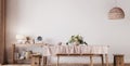 Farmhouse dining room design, wooden table and chairs on white wall background Royalty Free Stock Photo