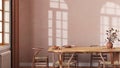 Farmhouse dining room with wooden table and chairs in orange and beige tones. Plaster walls, boho interior design Royalty Free Stock Photo