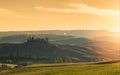 Farmhouse, green hills,cypress trees in Tuscany at sunrise