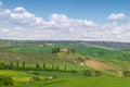 Farmhouse, green hills,cypress trees in Tuscany