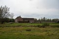 Farmhouse and green lawn at the Flemish countryside around Wichelen, Belgium