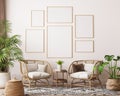 Farmhouse interior living room, gallery wall frame mockup in white room with wooden furniture and lots of green plants Royalty Free Stock Photo