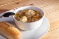 Farmhouse kitchen chicken stew with dumplings. Hot healthy winter food.