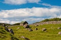 Farmhouse in Torshavn, Denmark. Old stone house in farm yard on cloudy blue sky. Typical rural architecture. Nature and Royalty Free Stock Photo