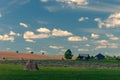 Farmhouse with wooden house and tractor Royalty Free Stock Photo