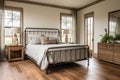 Farmhousestyle Guest Room With Wrought Iron Bed And Rustic Decor Modern Farmhouse Interior Design