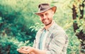 Farming and agriculture cultivation. Gardening. muscular ranch man in cowboy hat care plants. Eco farm worker. Earth day Royalty Free Stock Photo