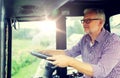 Senior man driving tractor at farm Royalty Free Stock Photo