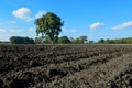 Farming, country style landscape with freshly plowed field