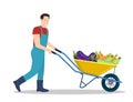 Farming man pushing wheelbarrow