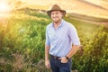 Farming is a profession of hope. a middle-aged farmer posing on a vineyard.