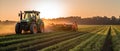 Farming tractor spraying plants in a field.