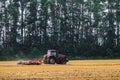 Farming tractor is working in the field Royalty Free Stock Photo