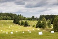 Farmland - Czech Canada - empty field with bale of straw packed in white Royalty Free Stock Photo