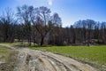 Farmland with dirt road with shed blue sky