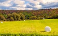 Farmland with Hay bales in Vermont landscape in early Autumn