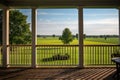 farmland horizon seen from porch of traditional farmhouse