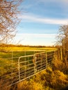 Farmland metal farm gate field closed locked agriculture nature