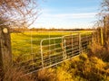 Farmland metal farm gate field closed locked agriculture nature