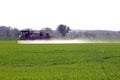 Farmer spraying crops In field in spring time In North Yorkshire April UK