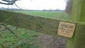 Farmland please close the gate sign Royalty Free Stock Photo