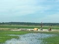 Flooded farmland and equipment in Iowa along interstate 29