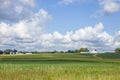 Farms and fields of corn and soybeans on sunny day with clouds during late summer in the midwest Royalty Free Stock Photo